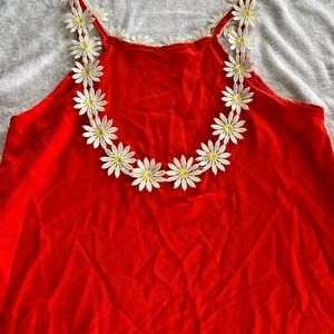 Bright orange daisy top with low back